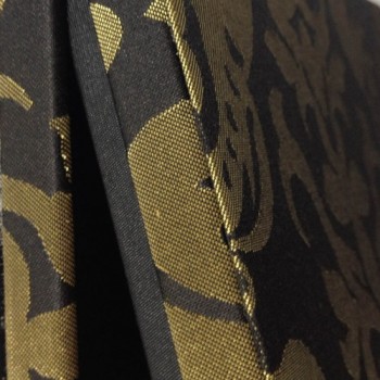 Close up of black and gold brocade silk box