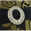 Large oval brooch in brocade silk with black ribbon