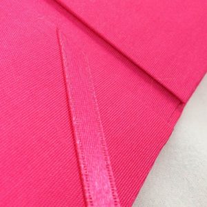 Detail view of ribbon holder of our deep pink pocket folder