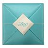 Ultra modern aqua blue silk folio invitation with monogram embroidered removable silk pad