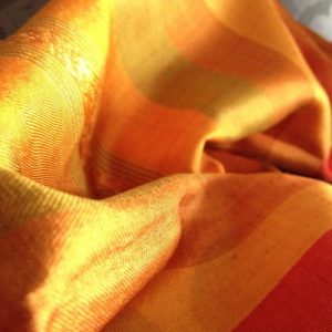 Picture of orange Thai silk shawl, muddle pattern
