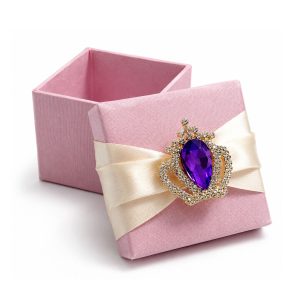 pink silk favor box with crown brooch