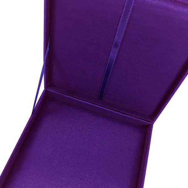 Interior of purple silk invitation box