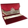 Opened velvet envelope showing pearl brooch and invitation card placed in it's pocket holder