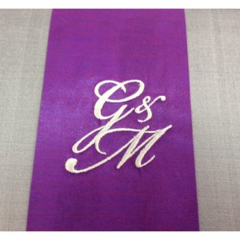 Monogram embroidered silk wedding inviattion box with hinged lid.