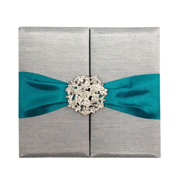 Grey folio with teal ribbon and brooch