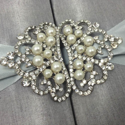 Silver pearl brooch in shape of a crown