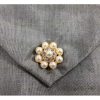 Close-up view of pearl button on silk envelope