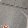 Inside view of pockets of a silver silk folio for wedding cards