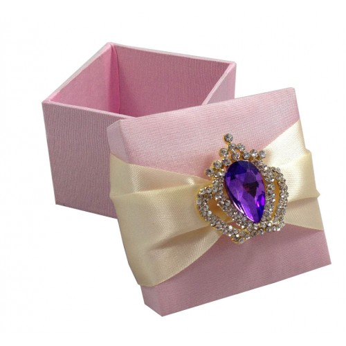 Purple rhinestone crown brooch on pink silk favor box