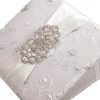 Large rhinestone brooch on lace invitation folio