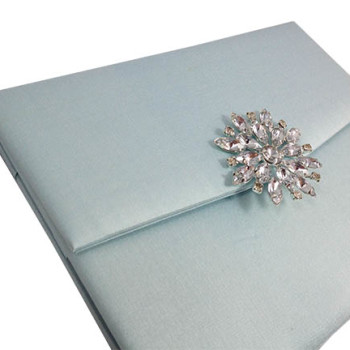 Star brooch on silk envelope