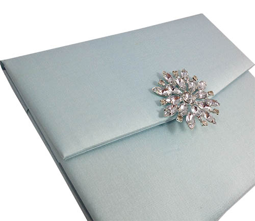 Star brooch on silk envelope