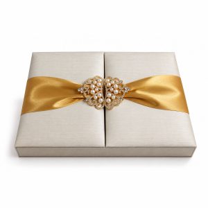 Luxury padded ivory silk invitation box featuring an elegant pearl crown clasp brooch
