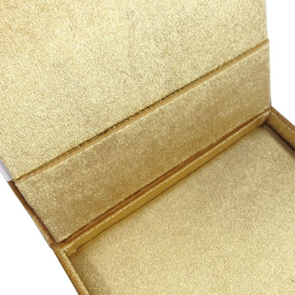 Pocket inside the boxed velvet wedding invitation featuring gold color