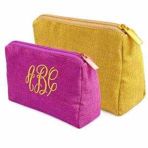 Embroidered silk cosmetic bag with golden zipper closure