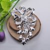 Backside with pin of our silver wedding brooch