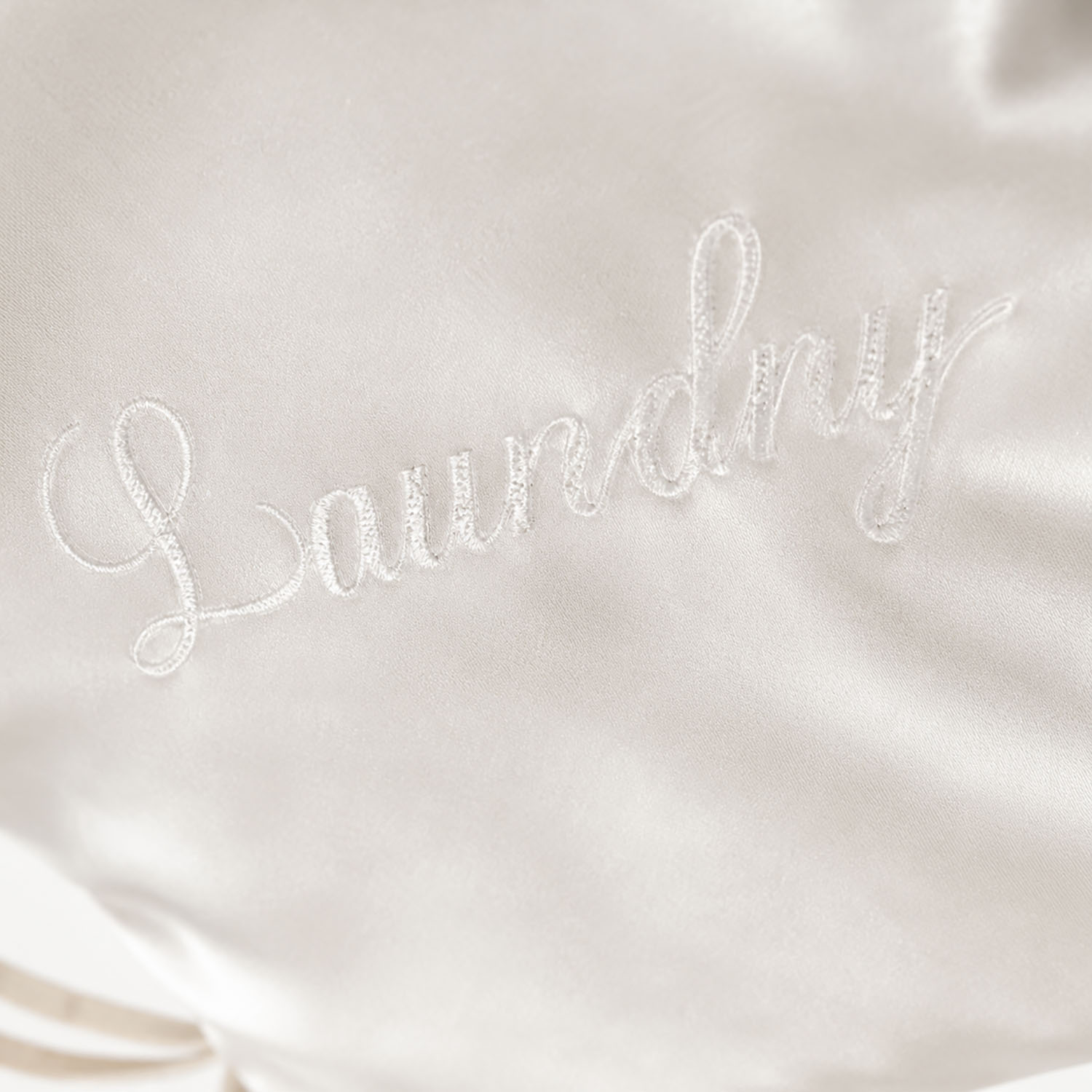 close up embroidery on satin bag