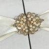 Pearl crown brooches