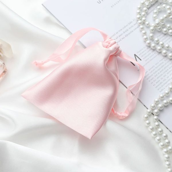 Drawstring bag with pink satin fabric