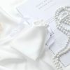 Drawstring bag with white satin fabric