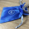 Embroidered blue Thai silk drawstring bag with silver initial embroidery
