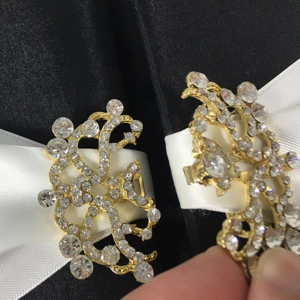 Golden brooch wedding embellishment