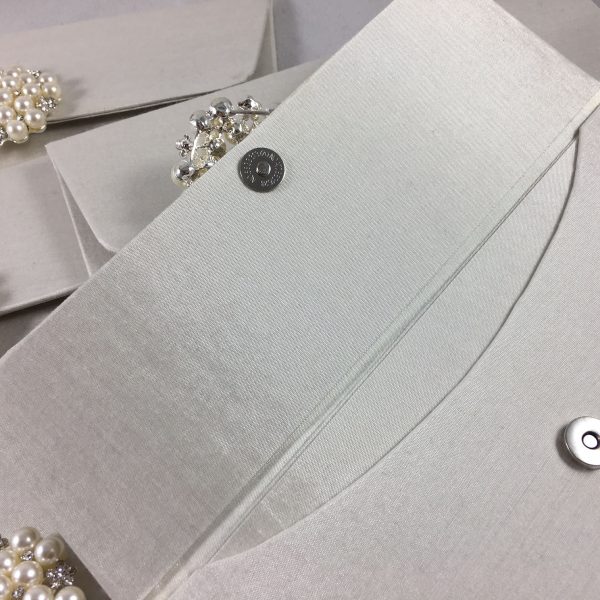 ivory wedding envelope with pearl brooch