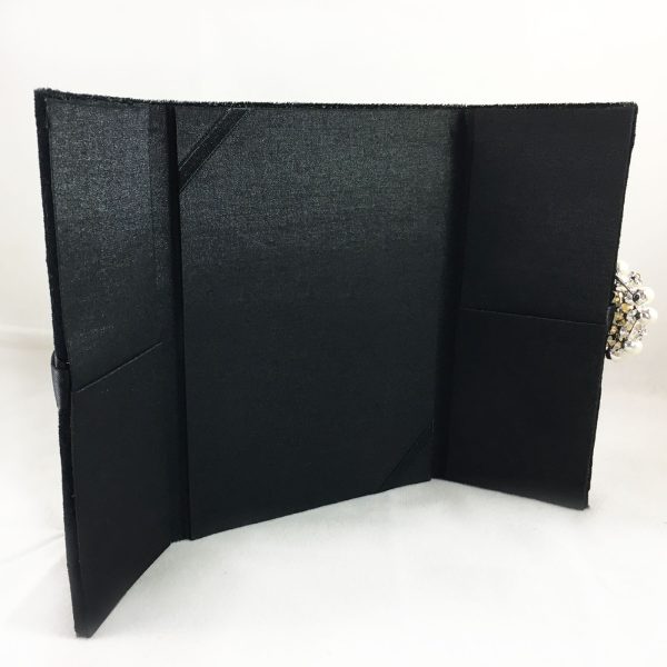 black velvet and silk invitation with pearl brooch embellishment