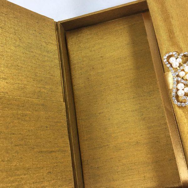 Goldenrod silk box with pearl brooch