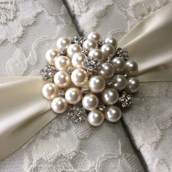 pearl brooch embellished lace invitation