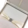 ivory silk wedding box with brooch