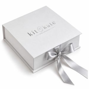 white paper invitation box with silver foil stamped logo