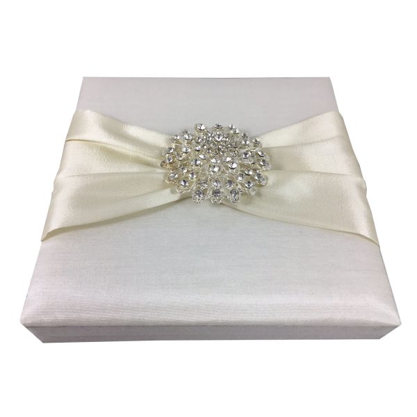 ivory boxed wedding invitation with large crystal flower brooch