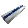 silver scroll box with navy blue ribbon