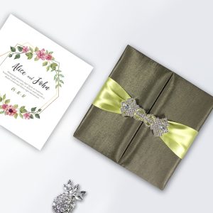boxed wedding invitation with wedding brooch