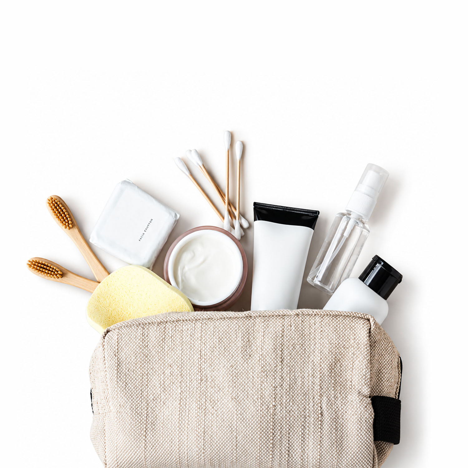 Beige hemp travel cosmetic bag with skincare and toiletry essentials