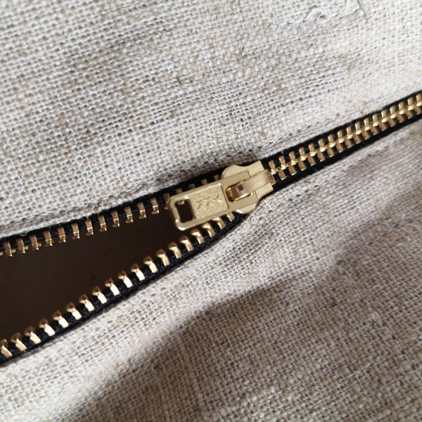 golden zipper pull