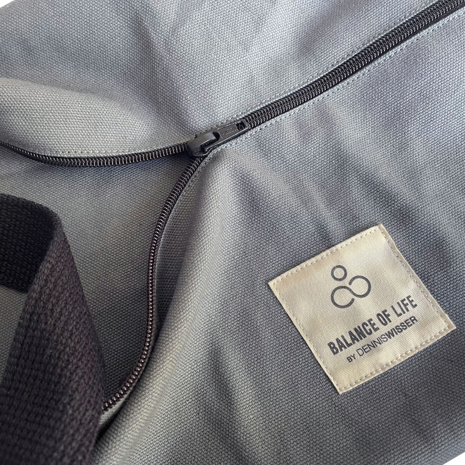 woven label on grey bag
