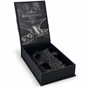 Black silk masquerade invitation box with satin ribbon, fleur-de-lis rhinestone brooch and glitter mask