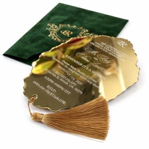 Mirror gold acrylic invitation with green velvet sleeve an foil stamp