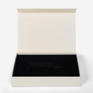 Cream paper box with magnetic closure and custom laser cut foam inlay