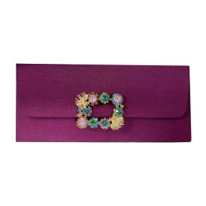 magenta silk envelope with rhinestone brooch