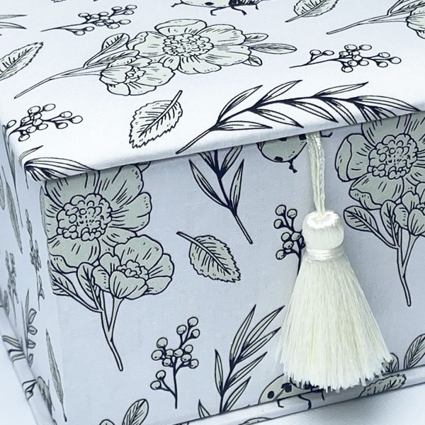 close up of white flower fabric gift box