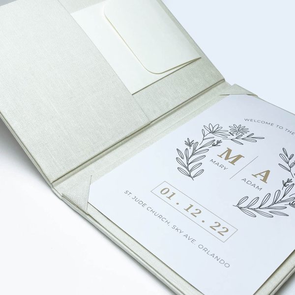 Close-up of ivory linen fabric invitation folio