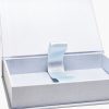 Zoomed in view of pale blue linen photo storage box for 4x6 inches photo keepsakes