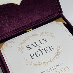 Close-up of velvet invitation box with cards