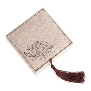 Linen box with printed lid and tassel embellishment for jewelry packaging