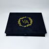 Black boxed invitation with golden UV monogram