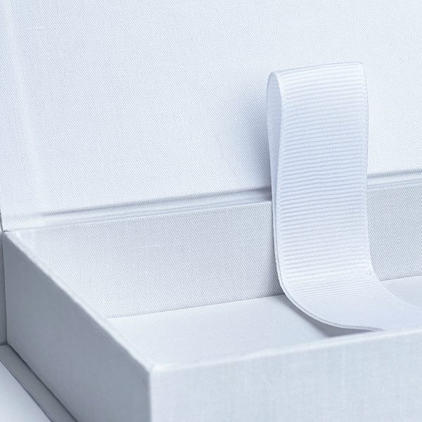 Close-up of white linen photo box